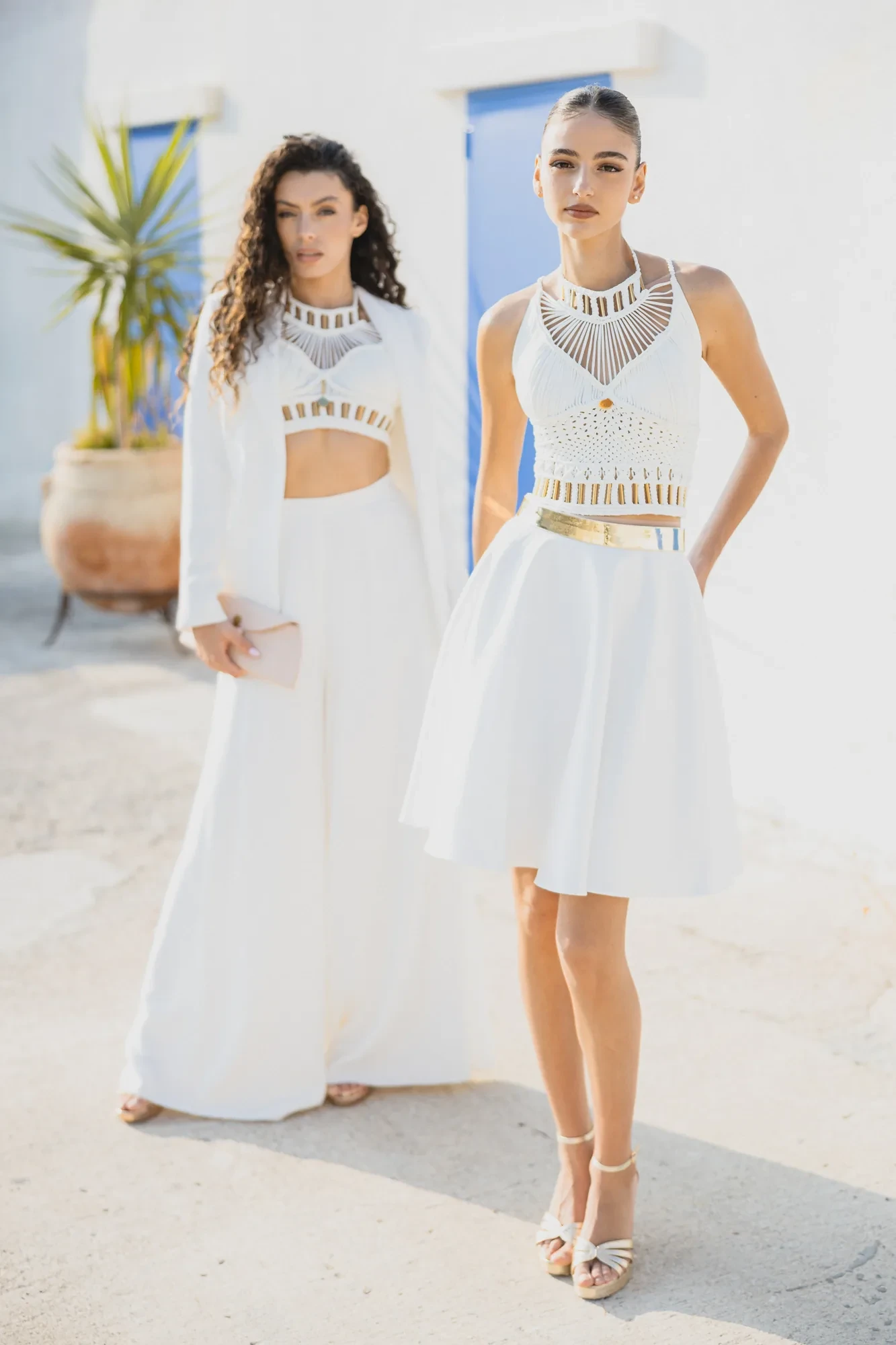 two-brides-white-wall-blue-door.webp two-brides-white-wall-blue-door.webp