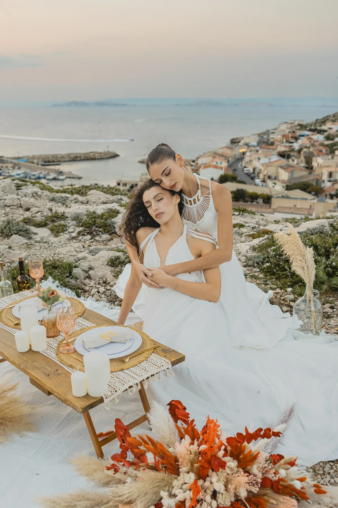 two-brides-embrace-harbor-view.webp two-brides-embrace-harbor-view.webp
