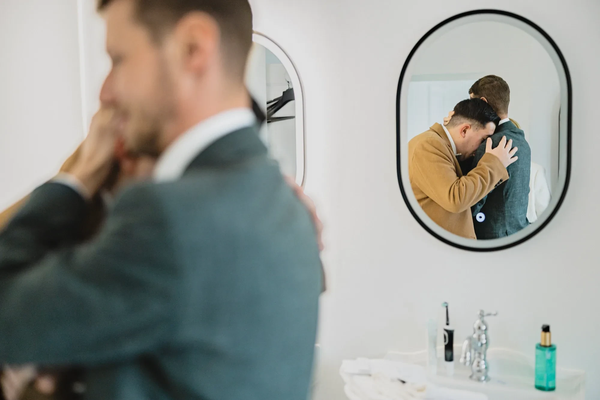 groom-embrace-mirror-reflection-prep.webp groom-embrace-mirror-reflection-prep.webp