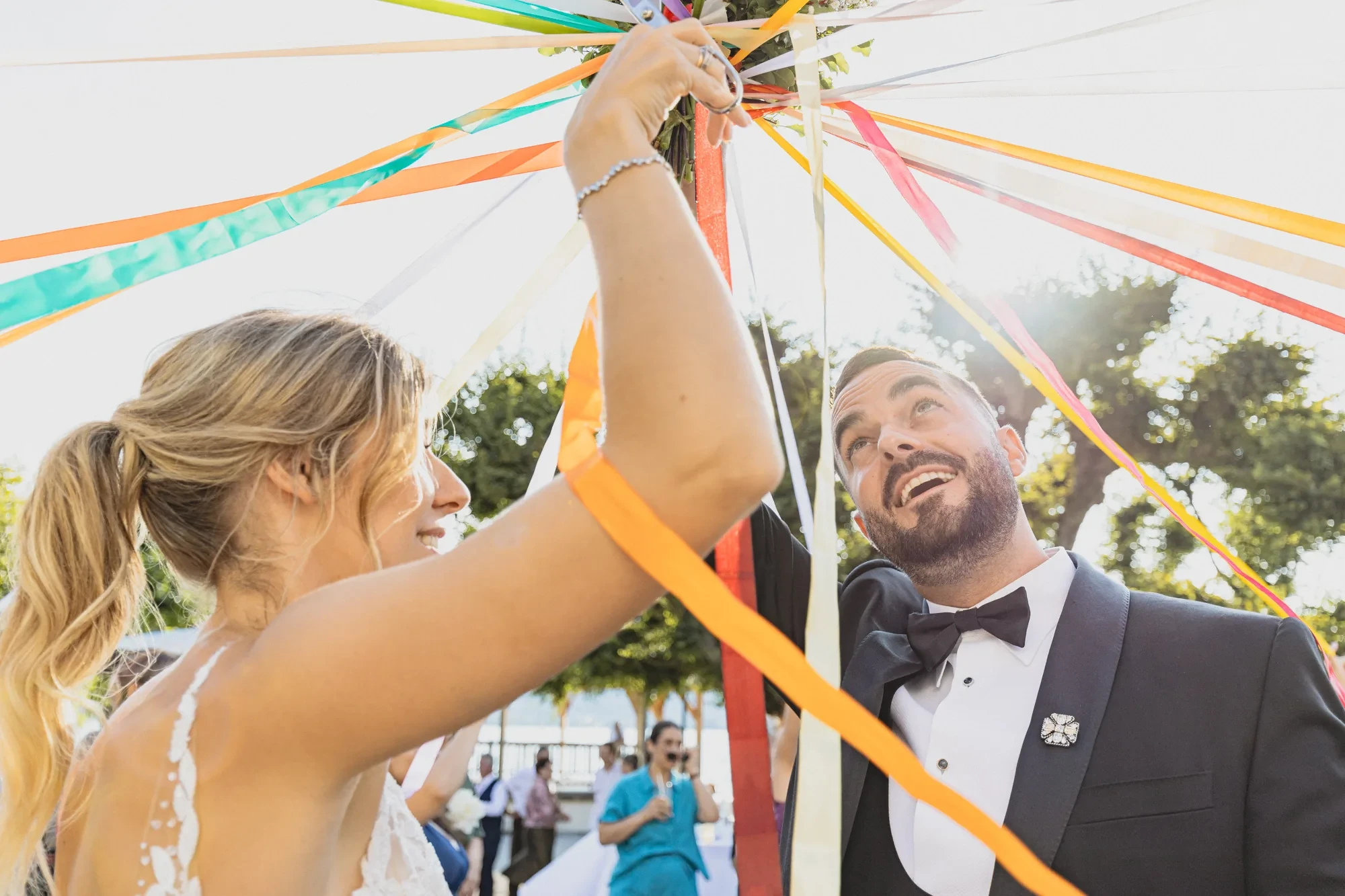 ribbon-game-newlyweds-laughing-outdoor.webp ribbon-game-newlyweds-laughing-outdoor.webp