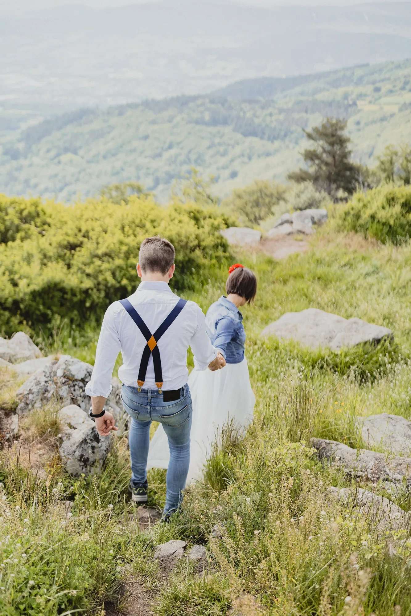 newlyweds-walking-mountain-trail.webp newlyweds-walking-mountain-trail.webp