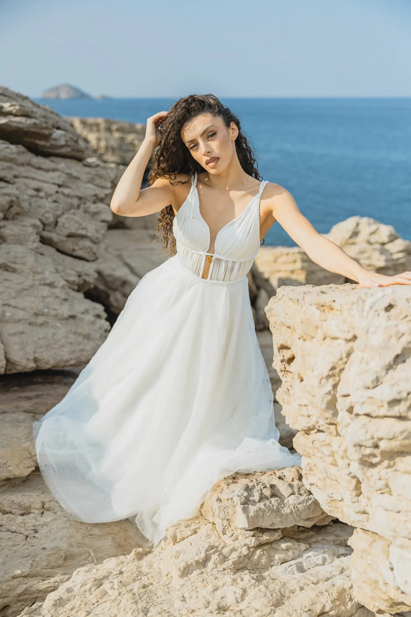 Destination Wedding Ischia Island – 2026 Planning Guide 2 bride-tulle-dress-sitting-rocks.webp